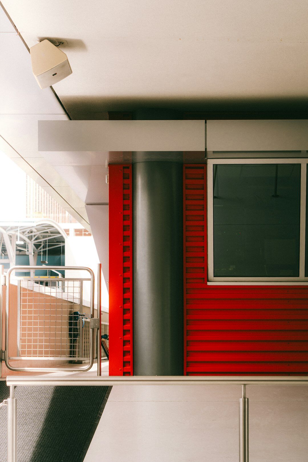 Warm editorial office with archive shelves and vintage automobile photographs on the wall
