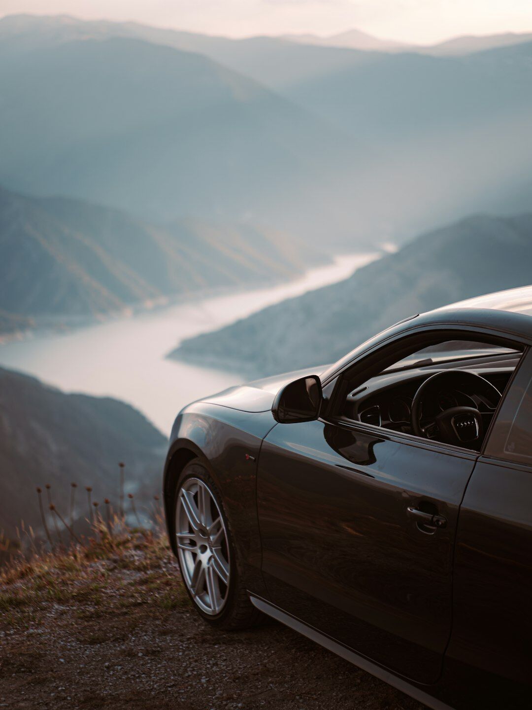 luxury car on scenic mountain road