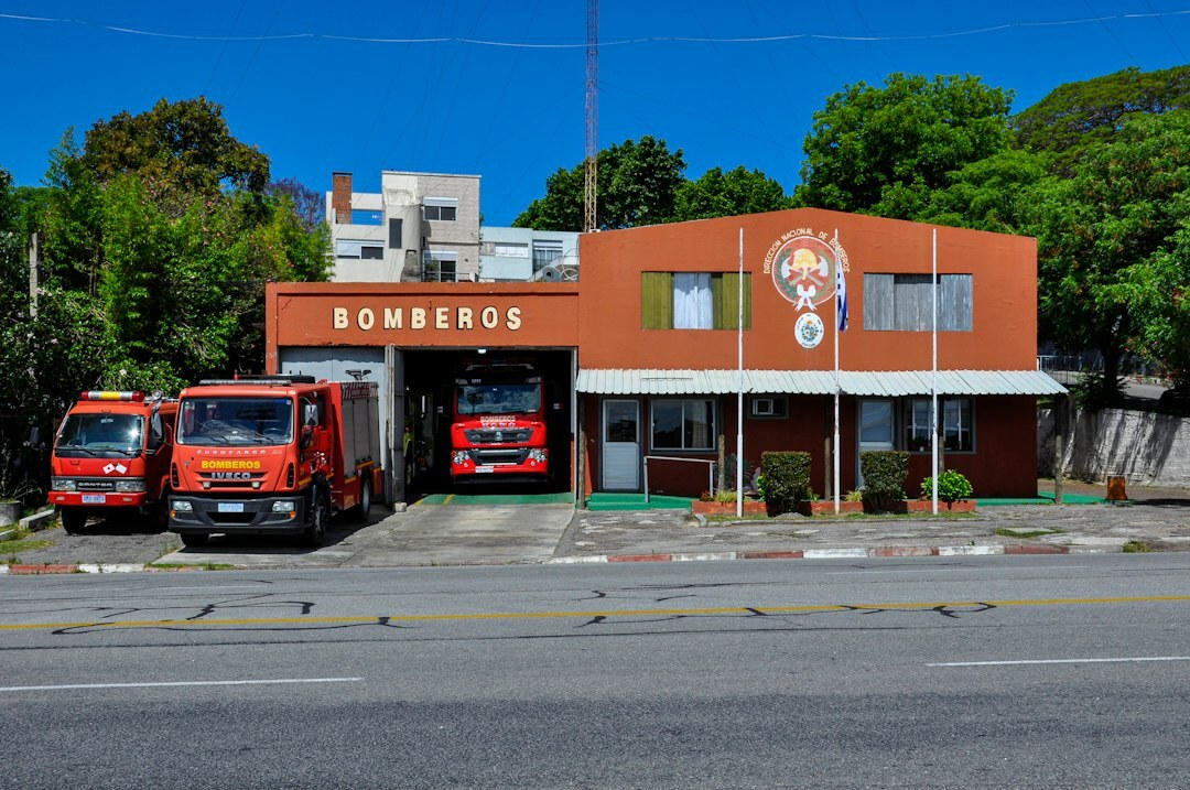 Historic stone garage in Colonia del Sacramento housing a restored vintage automobile