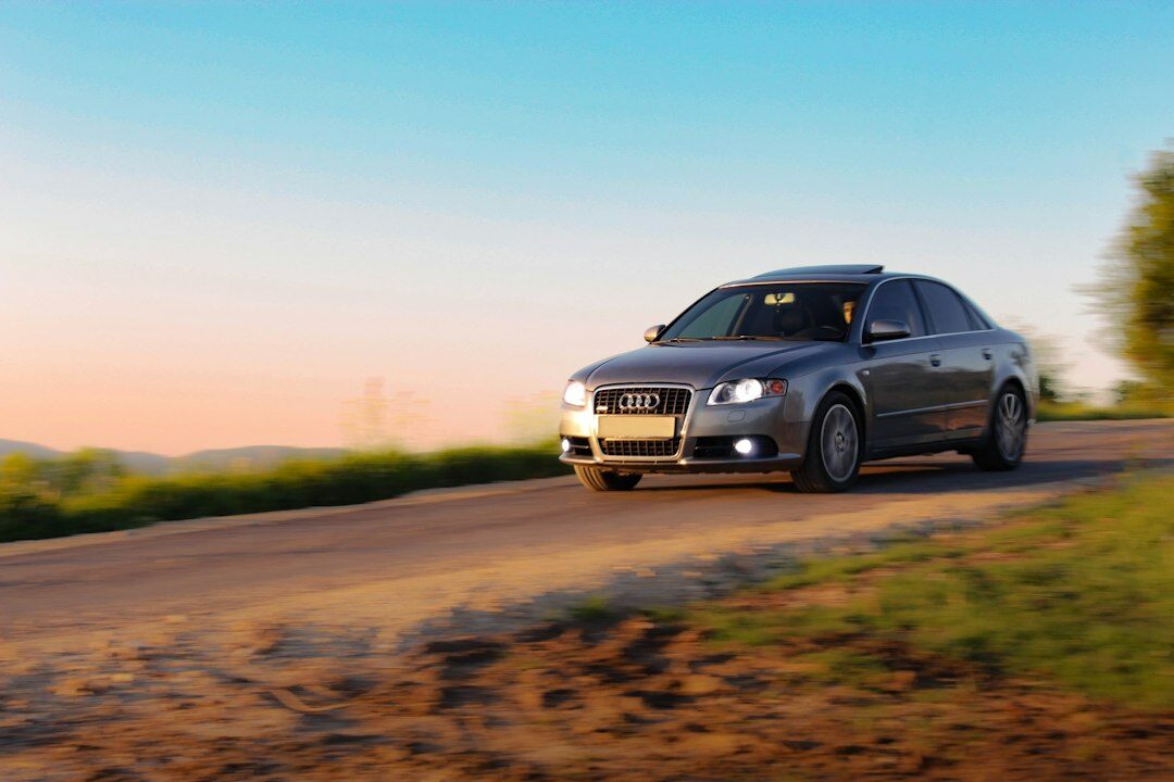 luxury sedan on countryside road
